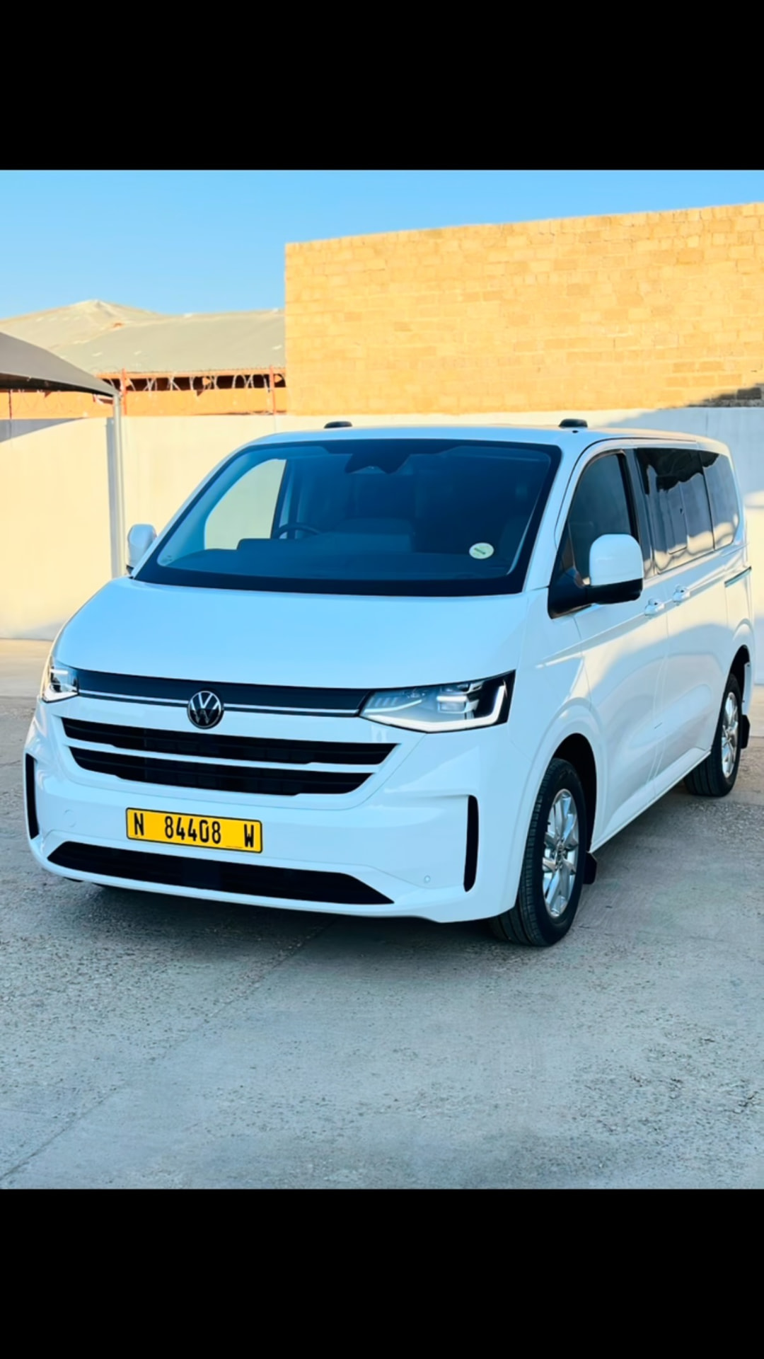 White Volkswagen Caravelle luxury shuttle available for group hire